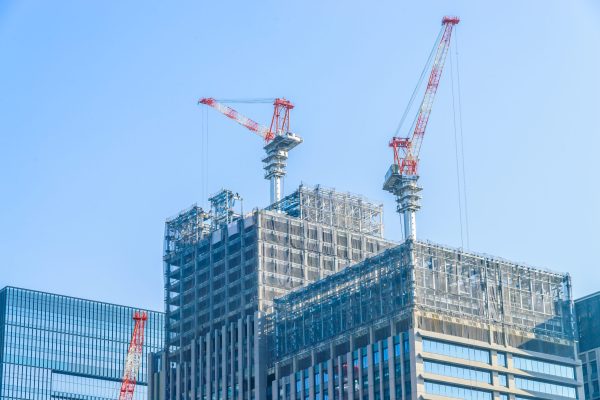 Crane construction building with blue sky background